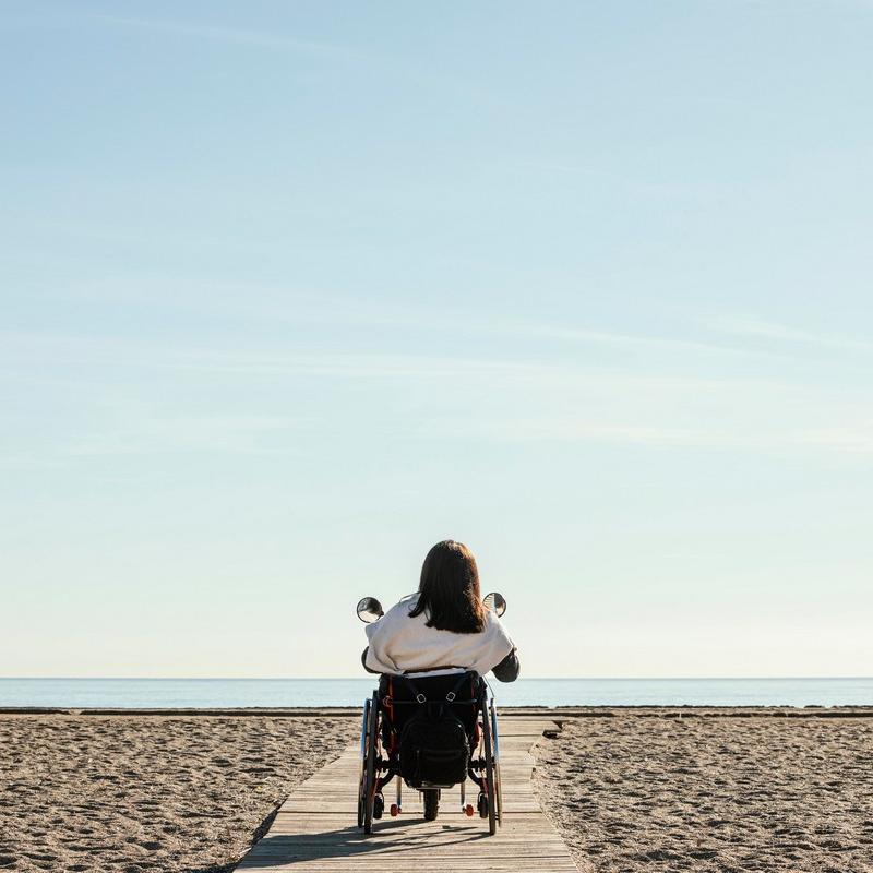 WOMAN WHEEL CHAIR